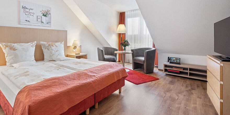 Schlossberghotel Oberhof, view into a comfort room. Book hotel Oberhof
