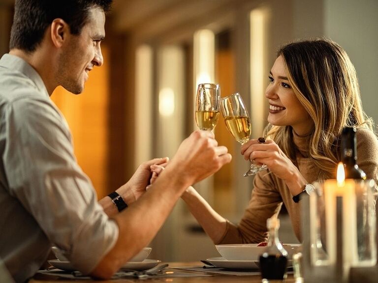 Couple having candlelight dinner in hotel